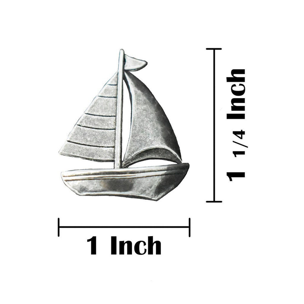 A handcrafted Sailboat Pin next to a ruler, available for sale at Creativeartisan.com - the image offers a sense of scale