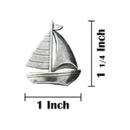 A handcrafted Sailboat Pin next to a ruler, available for sale at Creativeartisan.com - the image offers a sense of scale