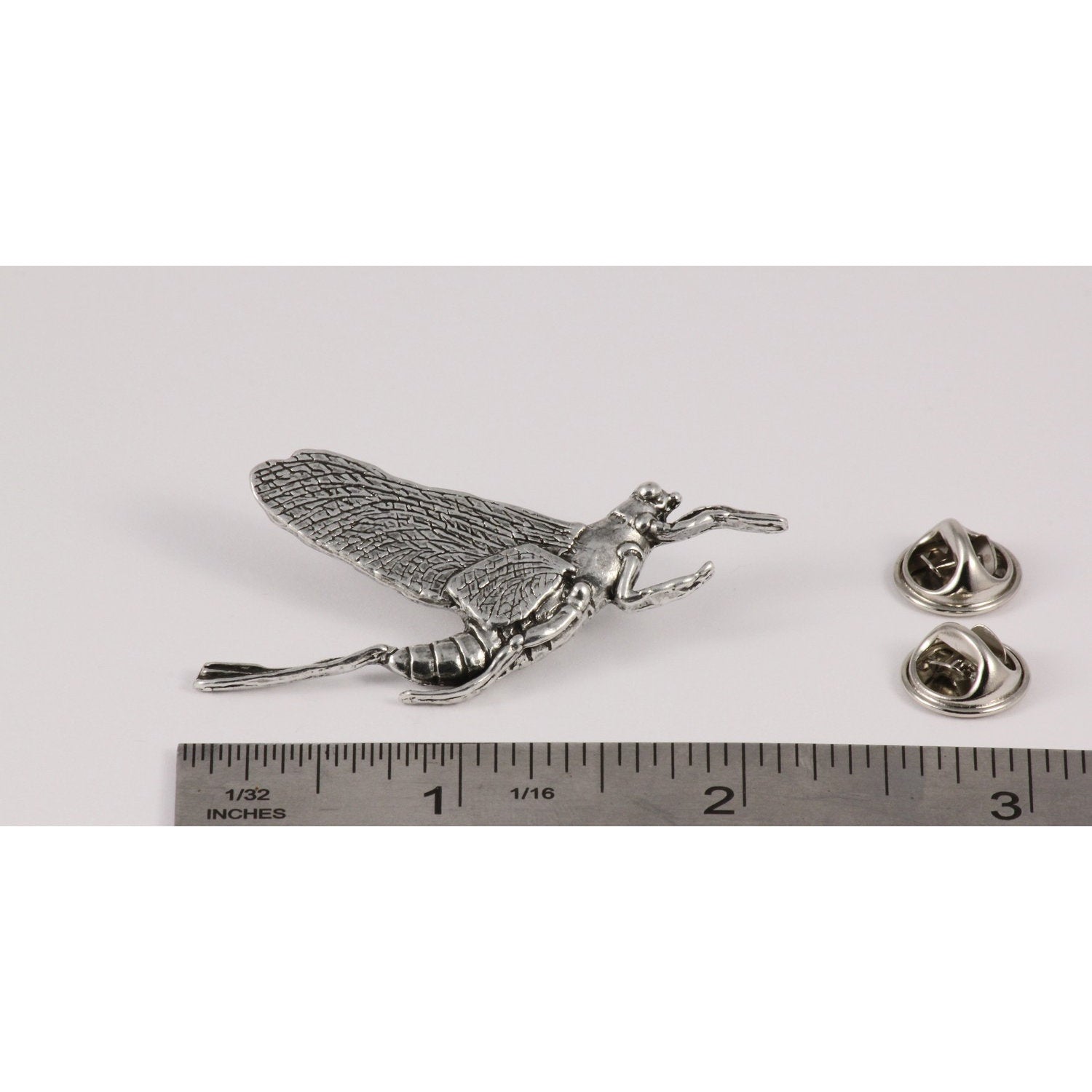 A handcrafted Mayfly Pin next to a ruler, available for sale at Creativeartisan.com - the image offers a sense of scale