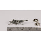 A handcrafted Grasshopper Pin next to a ruler, available for sale at Creativeartisan.com - the image offers a sense of scale
