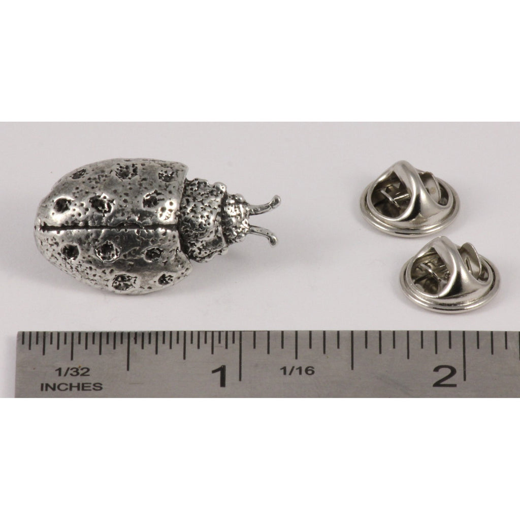A handcrafted Ladybug Pin next to a ruler, available for sale at Creativeartisan.com - the image offers a sense of scale
