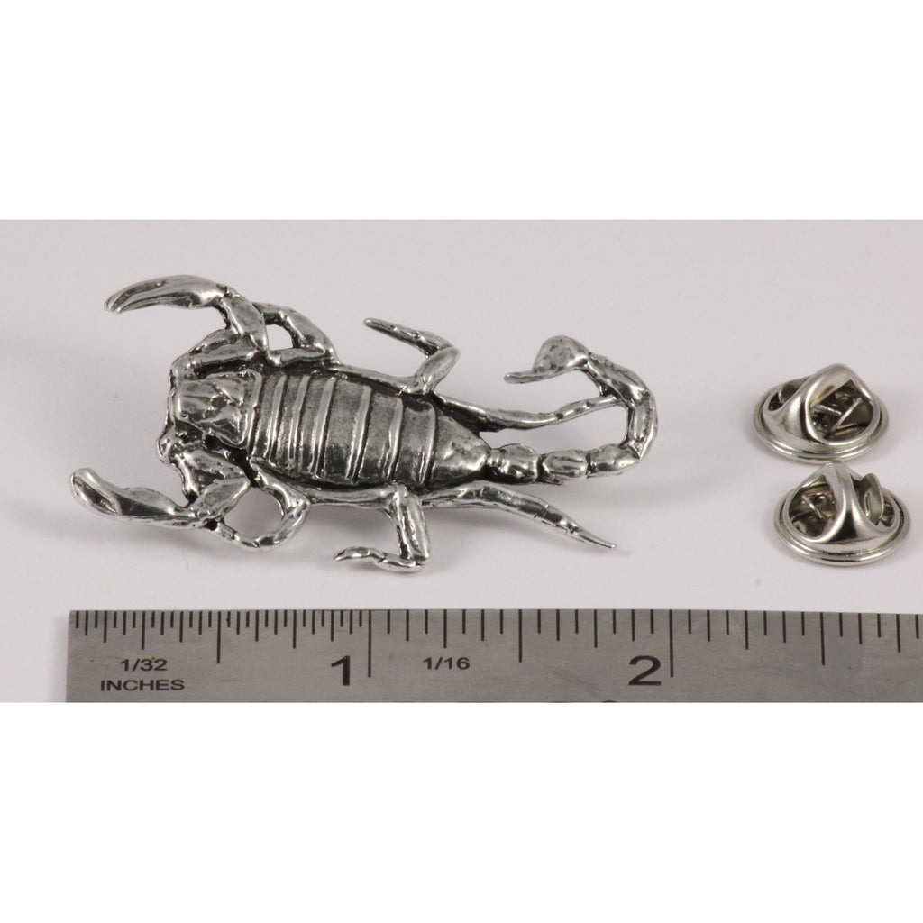 A handcrafted Scorpion Pin next to a ruler, available for sale at Creativeartisan.com - the image offers a sense of scale