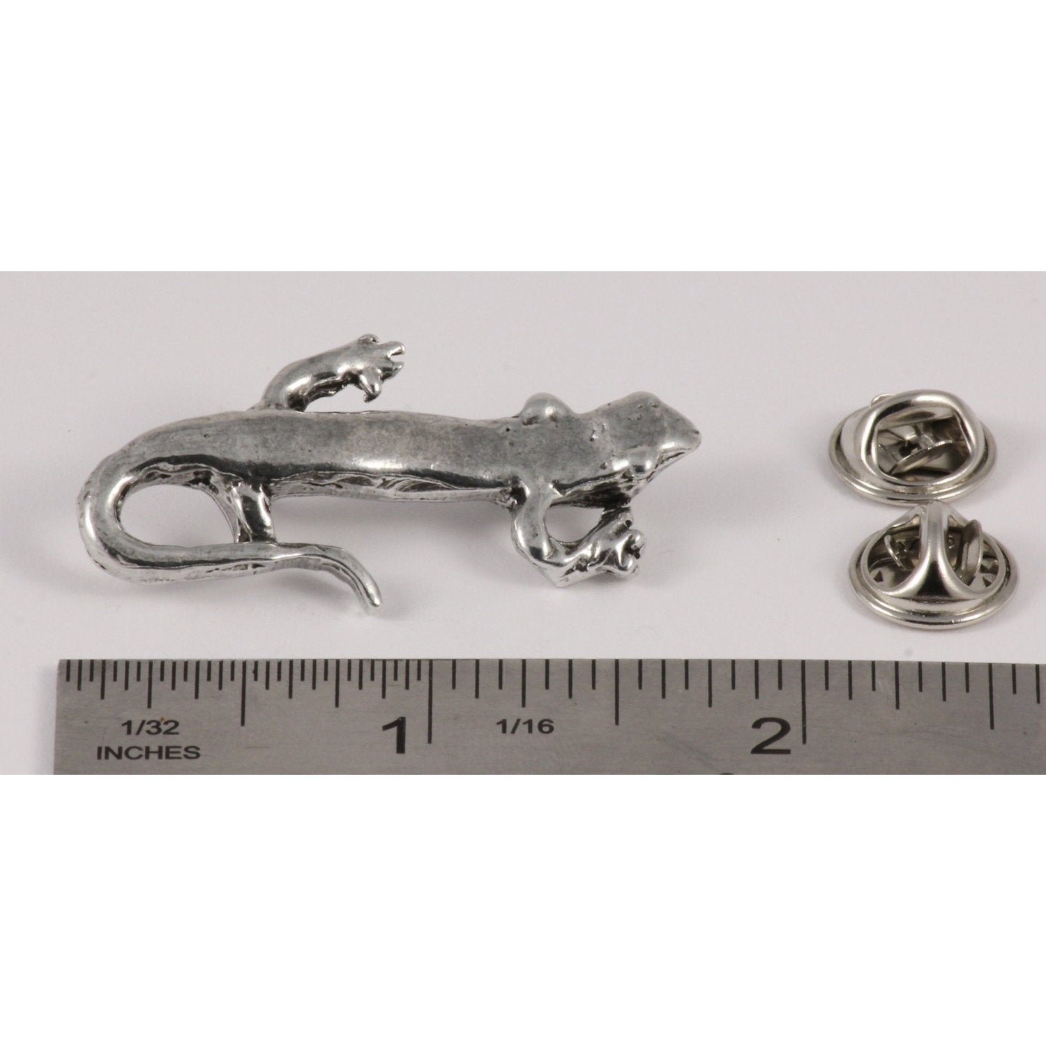 A handcrafted Salamander Pin next to a ruler, available for sale at Creativeartisan.com - the image offers a sense of scale