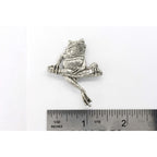 A handcrafted Frog On Branch Pin next to a ruler, available for sale at Creativeartisan.com - the image offers a sense of scale
