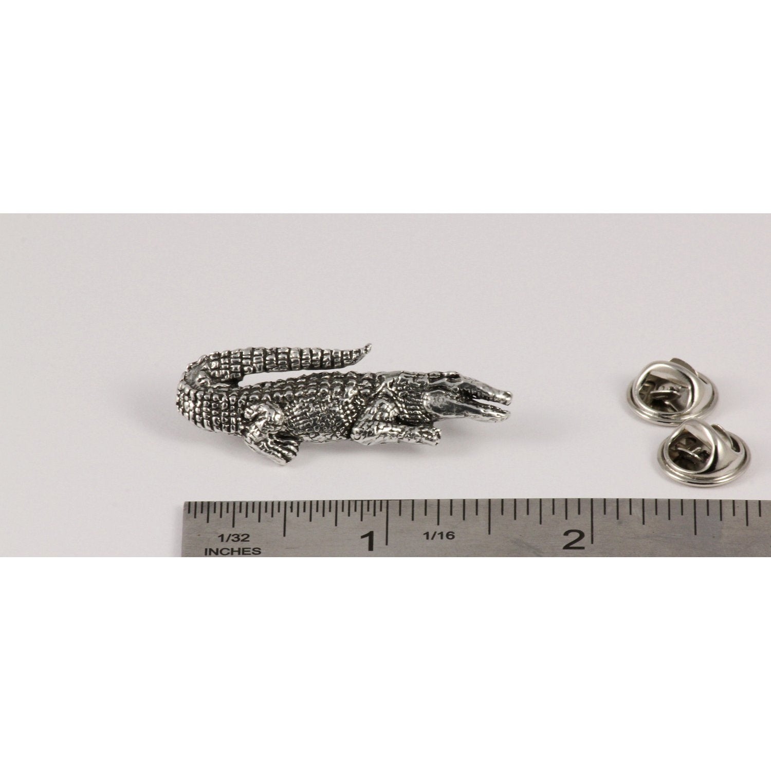 A handcrafted Alligator Pin next to a ruler, available for sale at Creativeartisan.com - the image offers a sense of scale