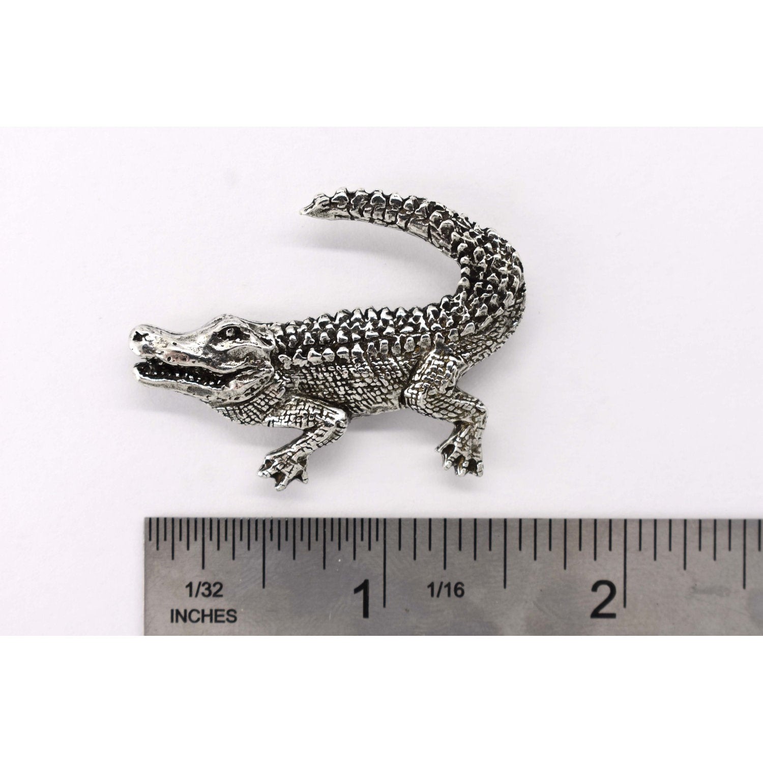 A handcrafted Alligator Crocodile Pin next to a ruler, available for sale at Creativeartisan.com - the image offers a sense of scale