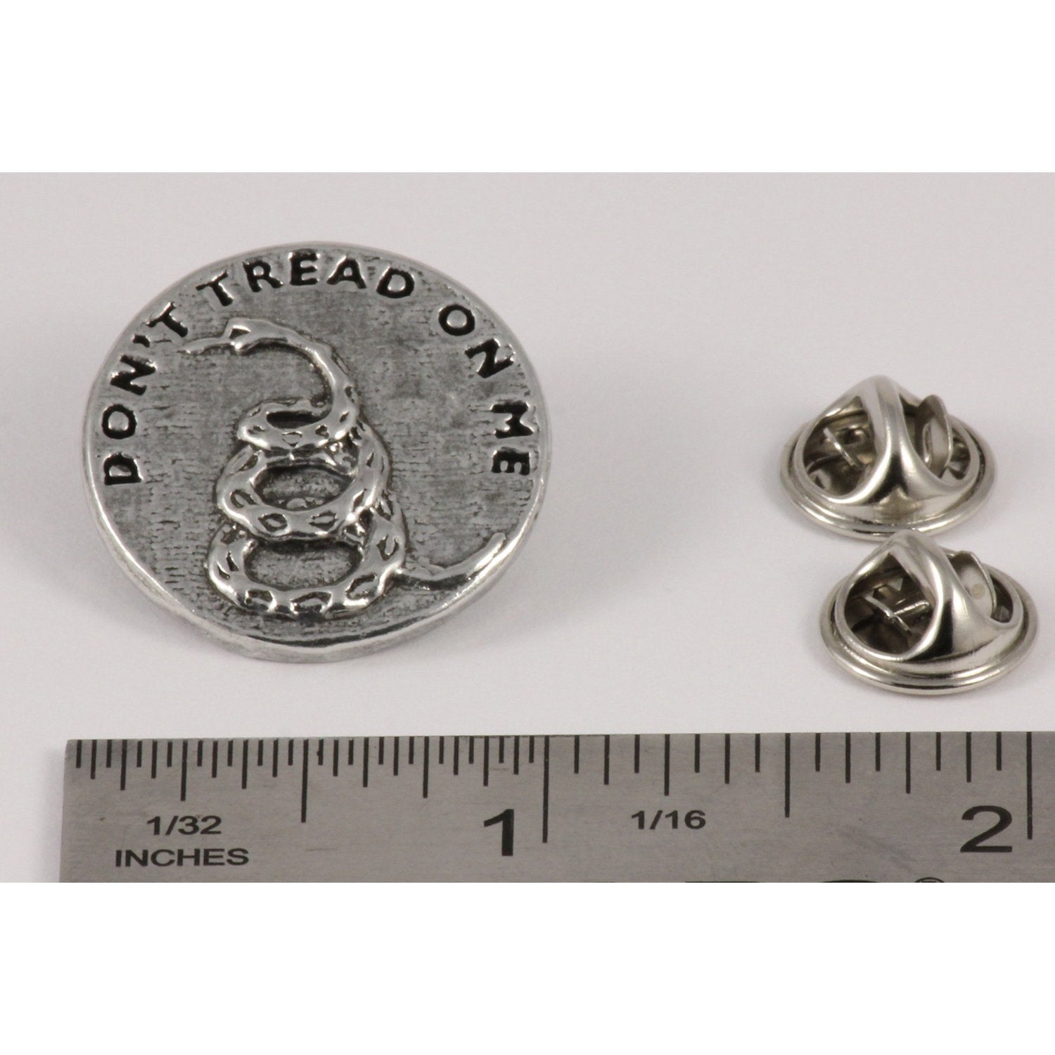 A handcrafted Dont Tread On Me Pin next to a ruler, available for sale at Creativeartisan.com - the image offers a sense of scale