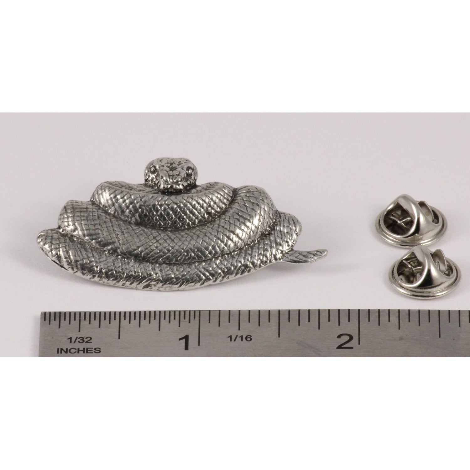 A handcrafted Python Pin next to a ruler, available for sale at Creativeartisan.com - the image offers a sense of scale