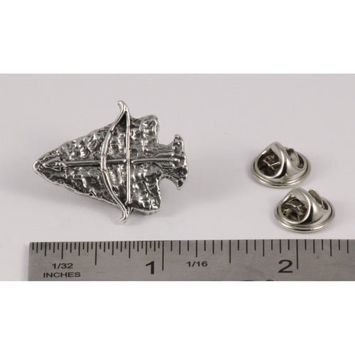 A handcrafted Arrowhead With Bow Pin next to a ruler, available for sale at Creativeartisan.com - the image offers a sense of scale