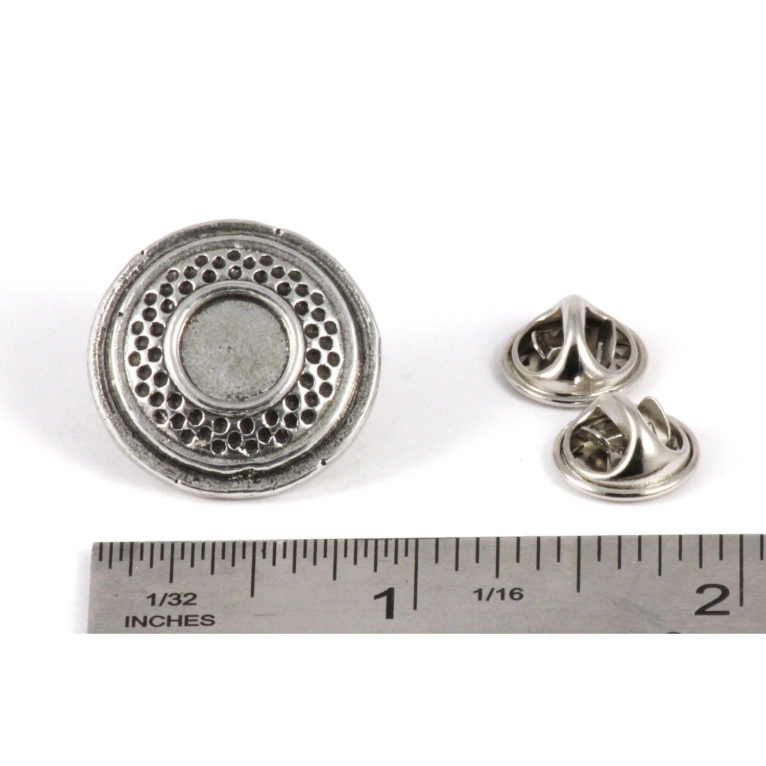 A handcrafted Clay Target Plain Pin next to a ruler, available for sale at Creativeartisan.com - the image offers a sense of scale