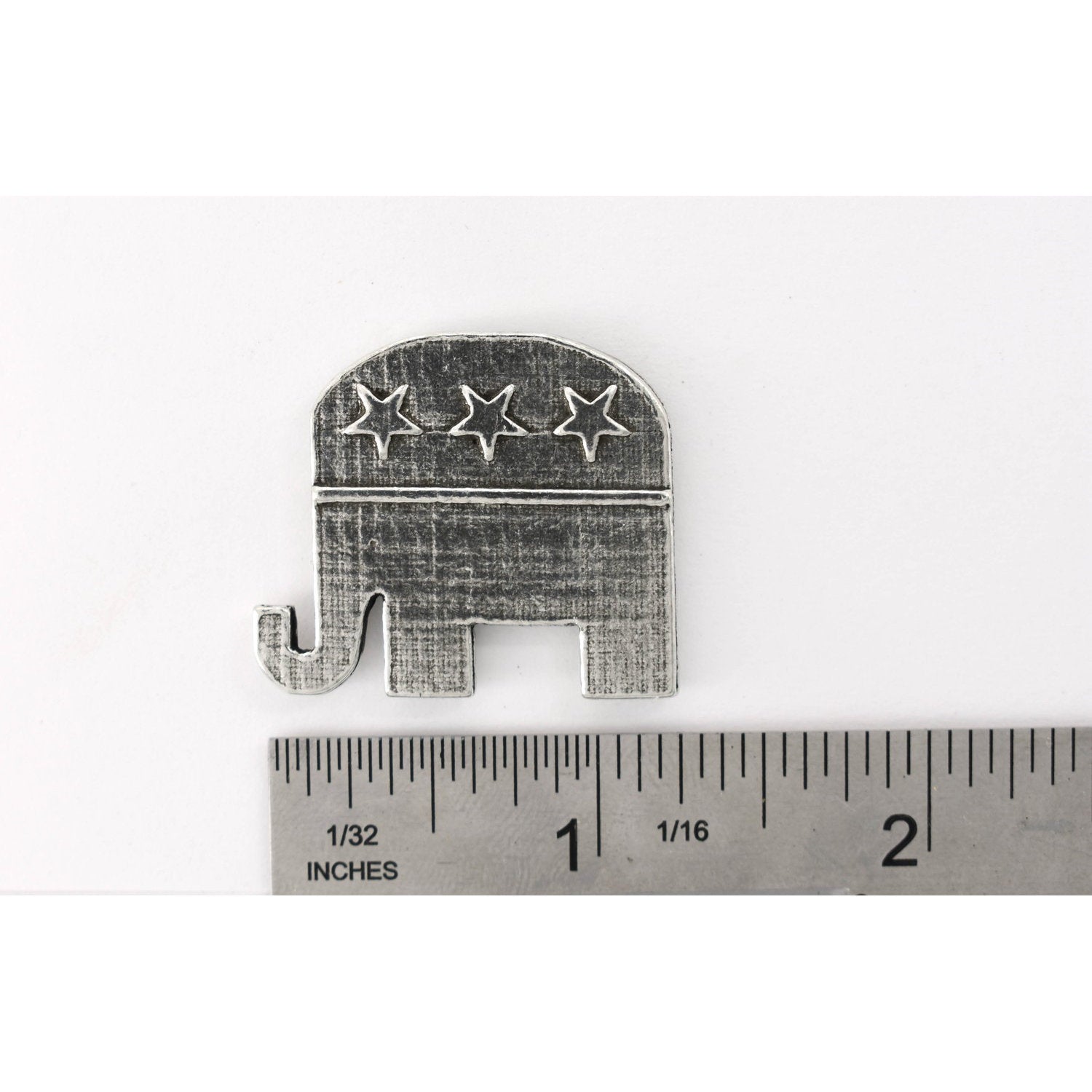 A handcrafted Republic Elephant Pin next to a ruler, available for sale at Creativeartisan.com - the image offers a sense of scale