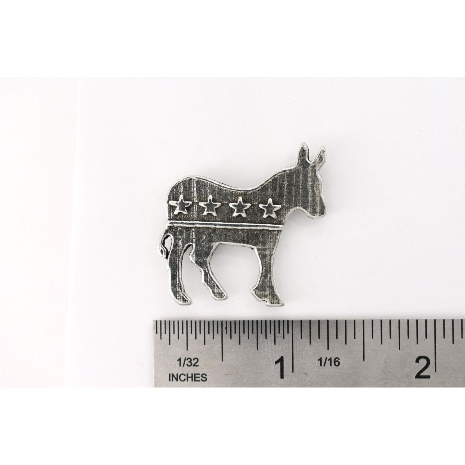 A handcrafted Democrat Monkey Pin next to a ruler, available for sale at Creativeartisan.com - the image offers a sense of scale