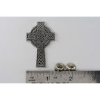 A handcrafted Celtic Cross New Pin next to a ruler, available for sale at Creativeartisan.com - the image offers a sense of scale