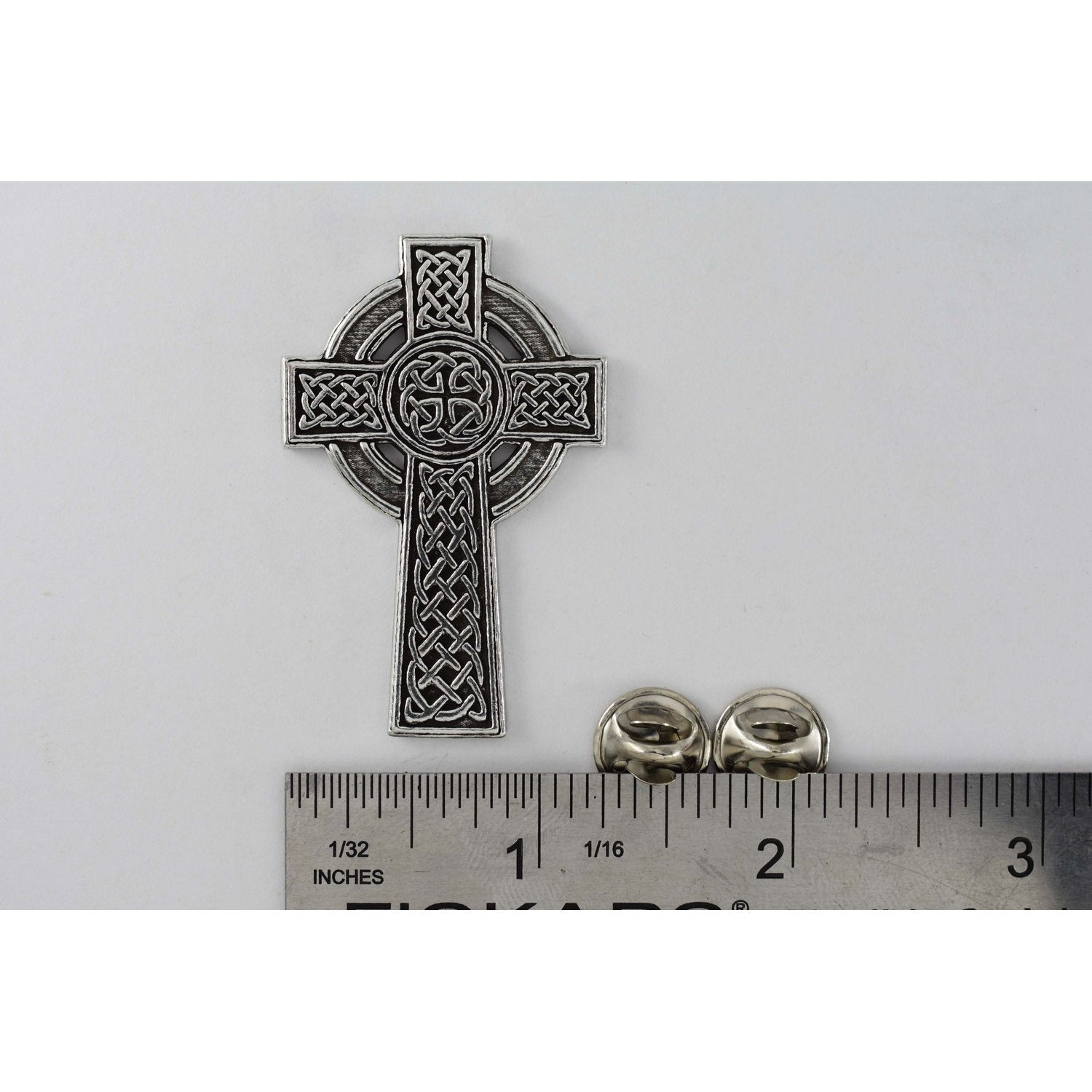 A handcrafted Celtic Cross New Pin next to a ruler, available for sale at Creativeartisan.com - the image offers a sense of scale