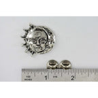 A handcrafted Sun And Moon Pin next to a ruler, available for sale at Creativeartisan.com - the image offers a sense of scale