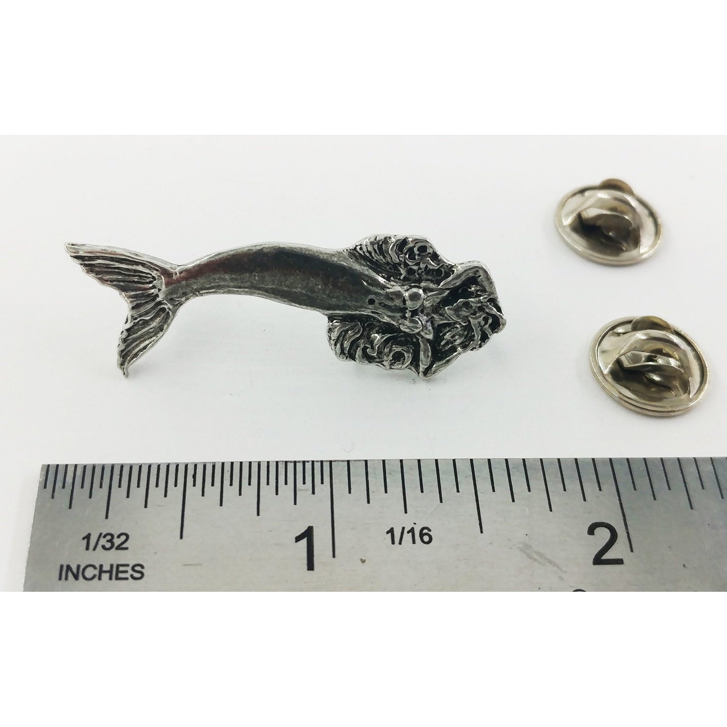 A handcrafted Mermaid Pin next to a ruler, available for sale at Creativeartisan.com - the image offers a sense of scale