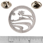 A handcrafted Palm Tree Pin next to a ruler, available for sale at Creativeartisan.com - the image offers a sense of scale