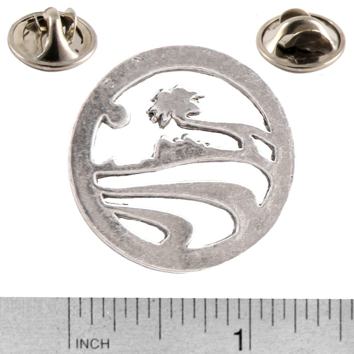 A handcrafted Palm Tree Pin next to a ruler, available for sale at Creativeartisan.com - the image offers a sense of scale