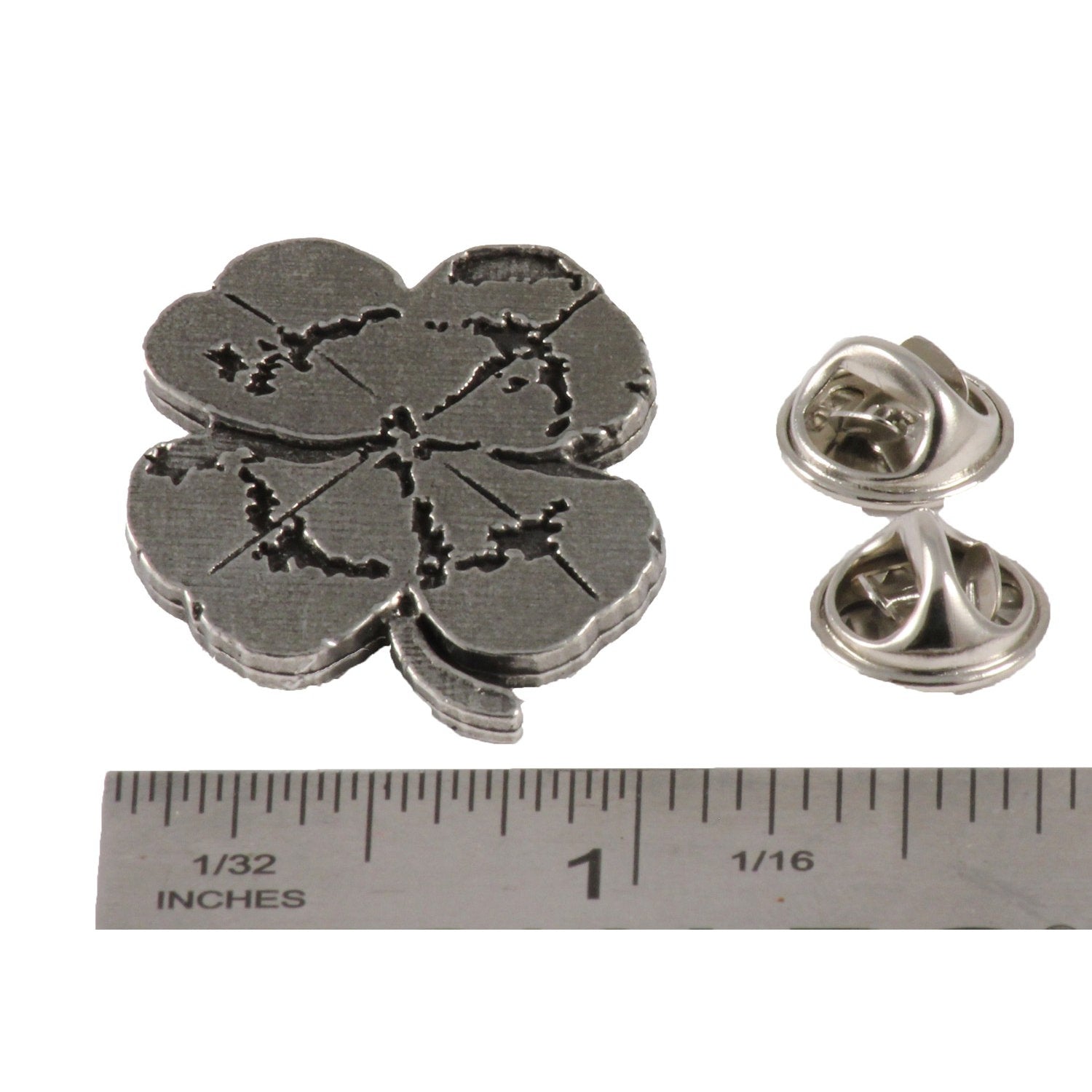 A handcrafted Four Leaf Clover Pin next to a ruler, available for sale at Creativeartisan.com - the image offers a sense of scale