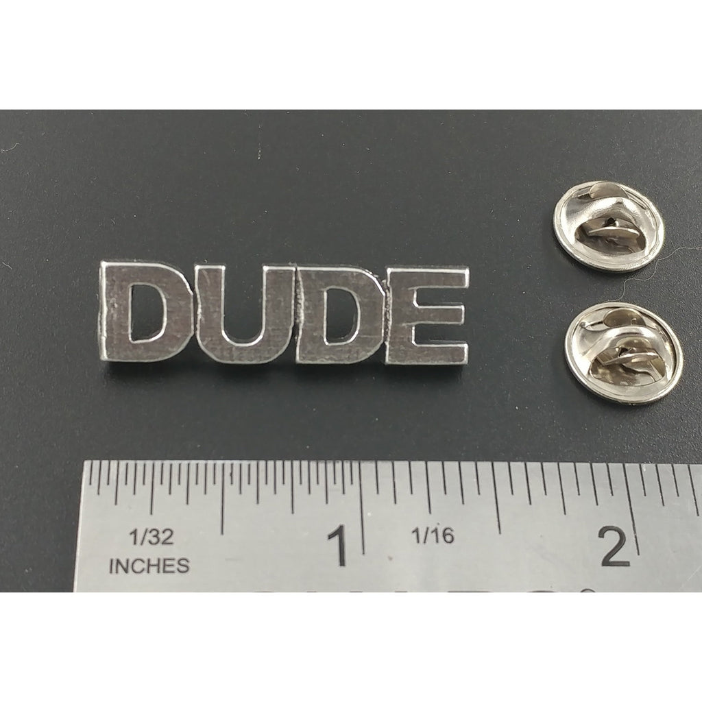A handcrafted Dude Pin next to a ruler, available for sale at Creativeartisan.com - the image offers a sense of scale
