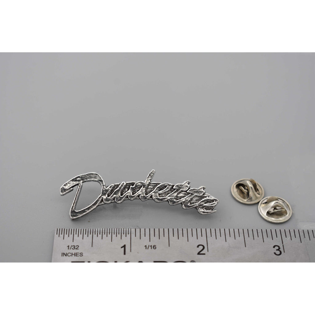 A handcrafted Dudette Pin next to a ruler, available for sale at Creativeartisan.com - the image offers a sense of scale