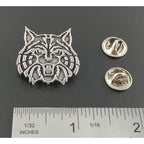A handcrafted Wildcat Pin next to a ruler, available for sale at Creativeartisan.com - the image offers a sense of scale