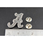 A handcrafted Fancy A Pin next to a ruler, available for sale at Creativeartisan.com - the image offers a sense of scale