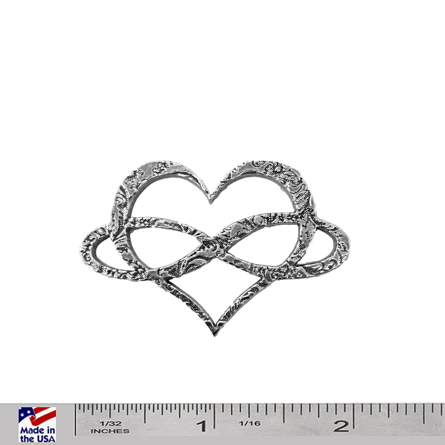 A handcrafted Infinity Heart Pin next to a ruler, available for sale at Creativeartisan.com - the image offers a sense of scale