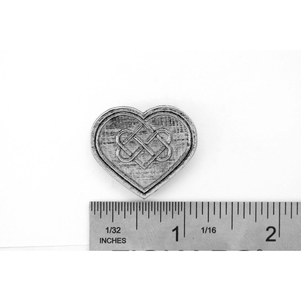 A handcrafted Heart With Celtic Knot Pin next to a ruler, available for sale at Creativeartisan.com - the image offers a sense of scale