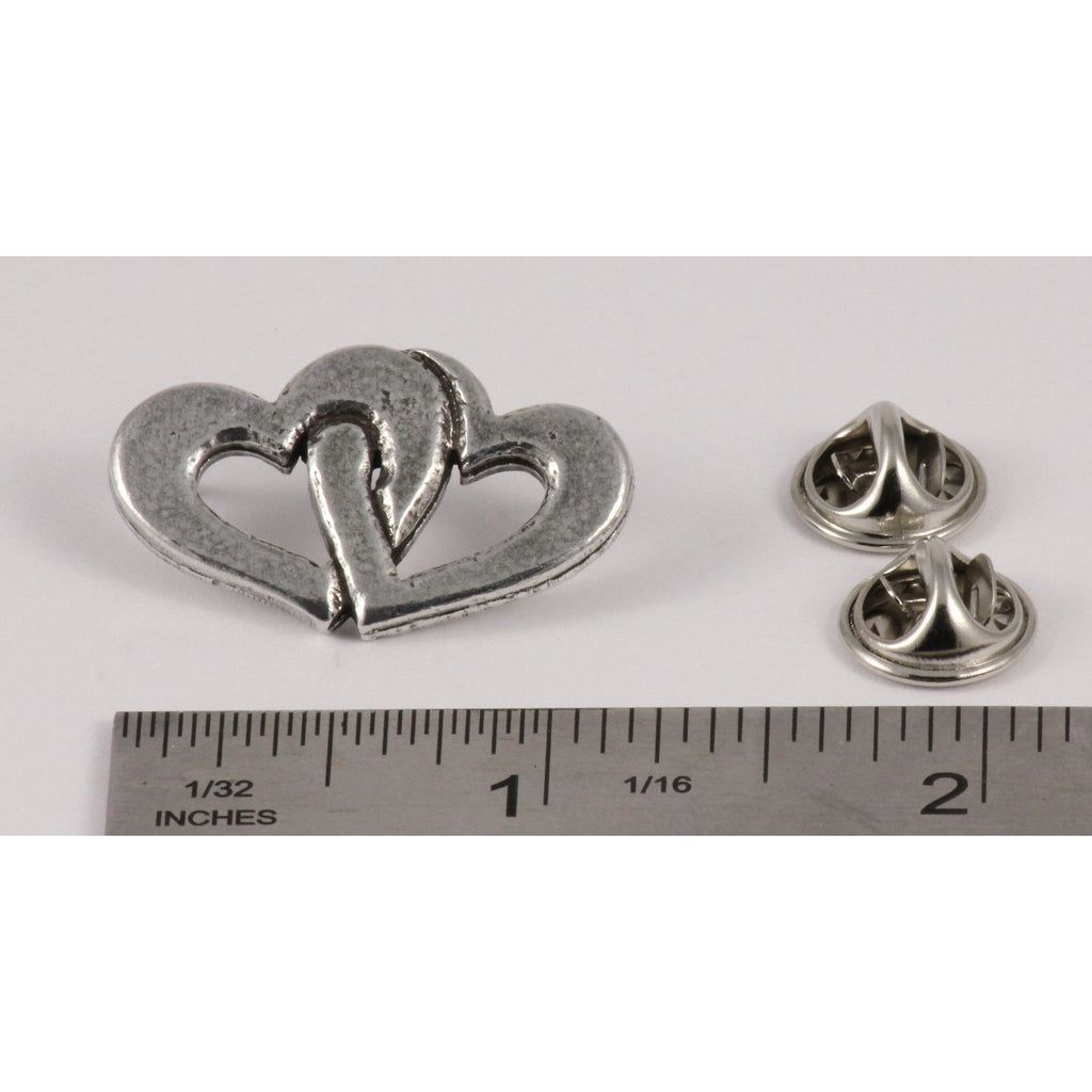 A handcrafted Double Heart Pin next to a ruler, available for sale at Creativeartisan.com - the image offers a sense of scale