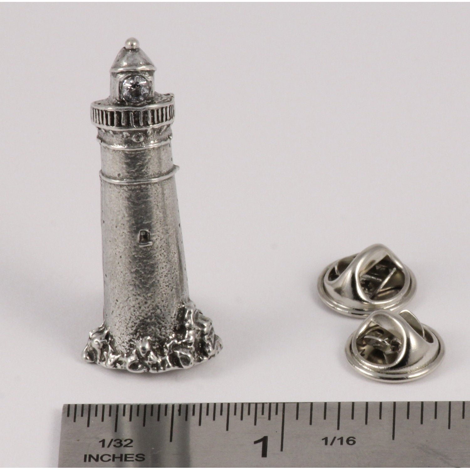 A handcrafted Lighthouse Pin next to a ruler, available for sale at Creativeartisan.com - the image offers a sense of scale