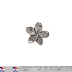A handcrafted Frangipani Flower Pin next to a ruler, available for sale at Creativeartisan.com - the image offers a sense of scale