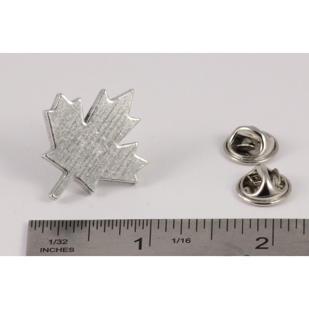 A handcrafted Canadian Maple Leaf Pin next to a ruler, available for sale at Creativeartisan.com - the image offers a sense of scale