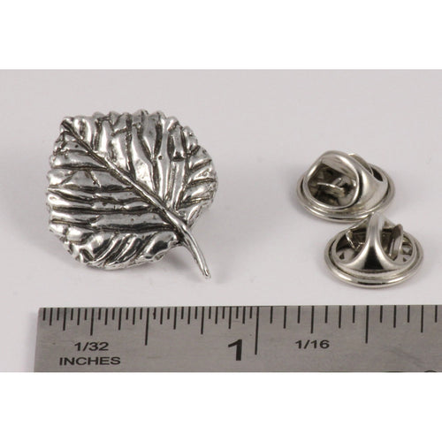 A handcrafted Aspen Leaf Pin next to a ruler, available for sale at Creativeartisan.com - the image offers a sense of scale