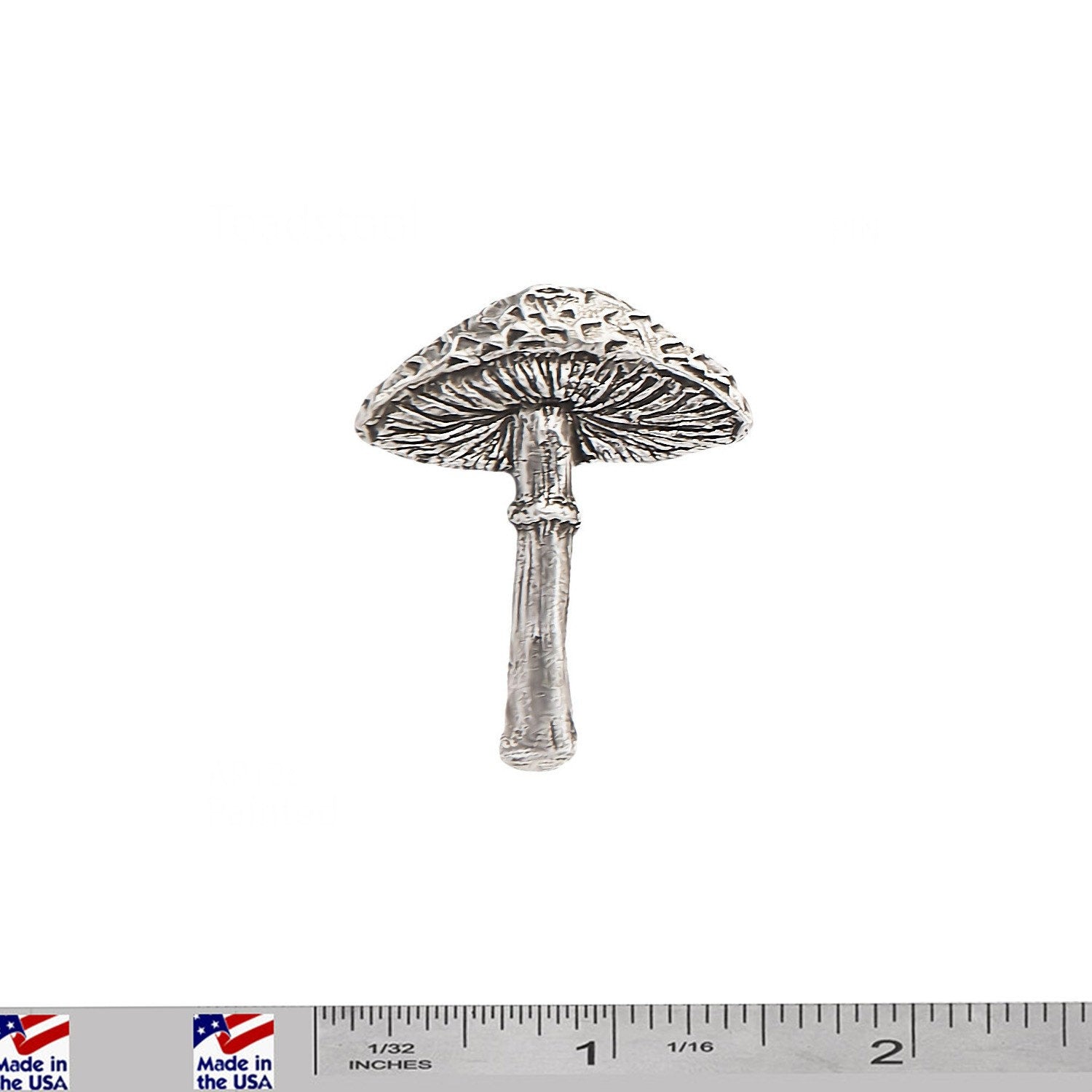 A handcrafted Toad Stool Mushroom Pin next to a ruler, available for sale at Creativeartisan.com - the image offers a sense of scale