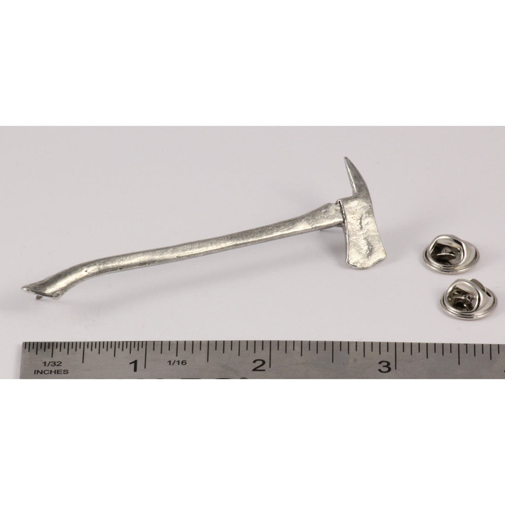 A handcrafted Firemans Axe Pin next to a ruler, available for sale at Creativeartisan.com - the image offers a sense of scale