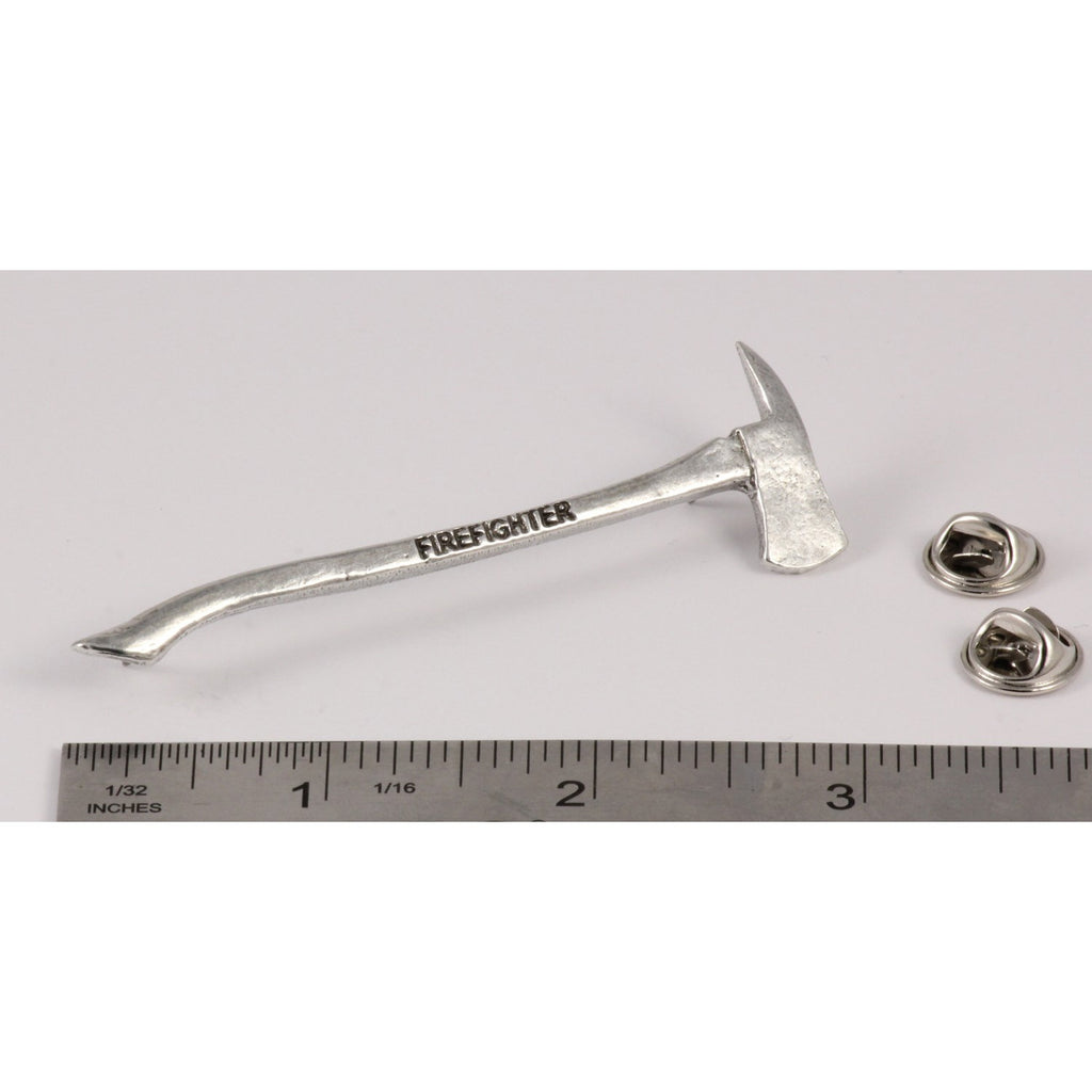 A handcrafted Firemans Axe Firefighter Engraved Pin next to a ruler, available for sale at Creativeartisan.com - the image offers a sense of scale