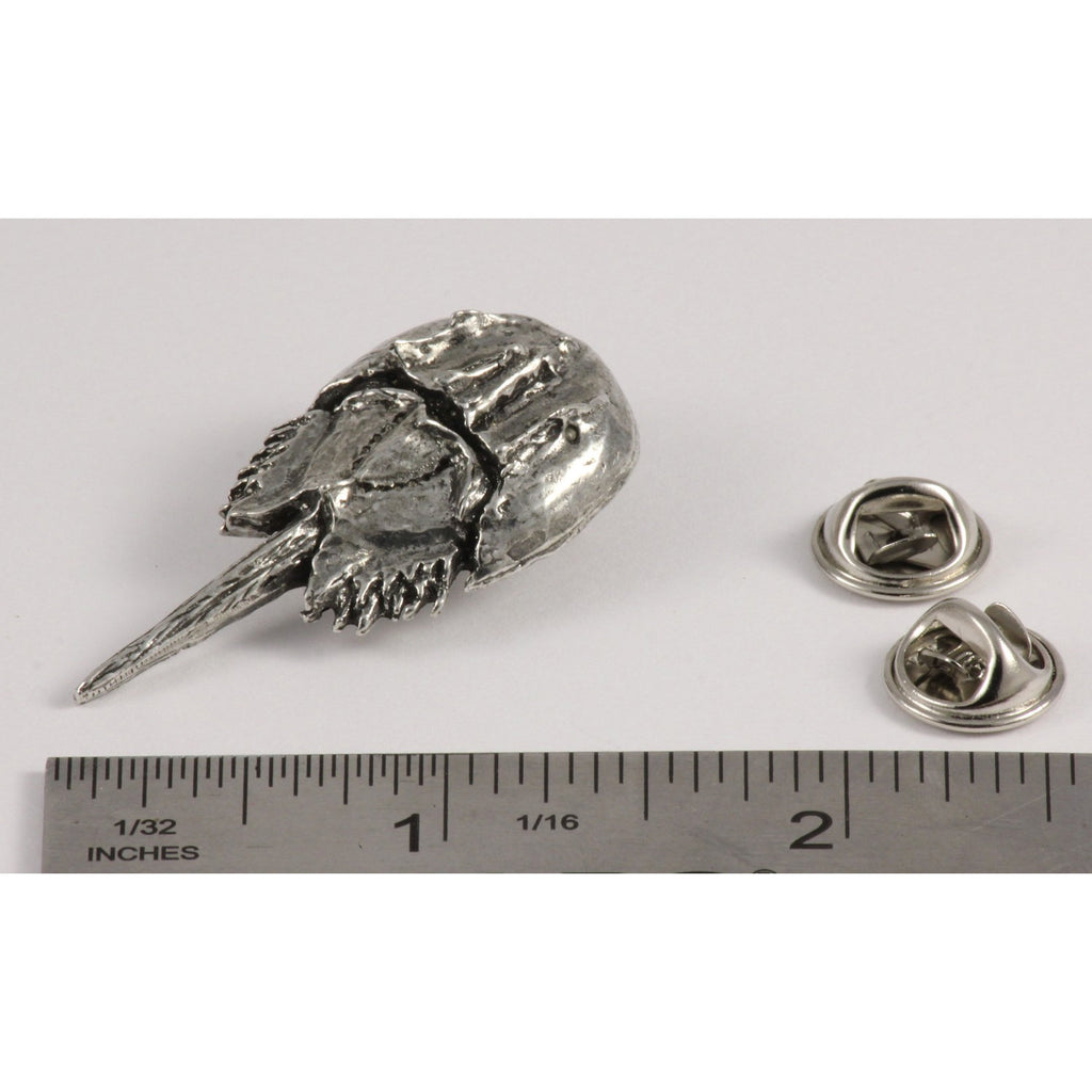 A handcrafted Horseshoe Crab Pin next to a ruler, available for sale at Creativeartisan.com - the image offers a sense of scale