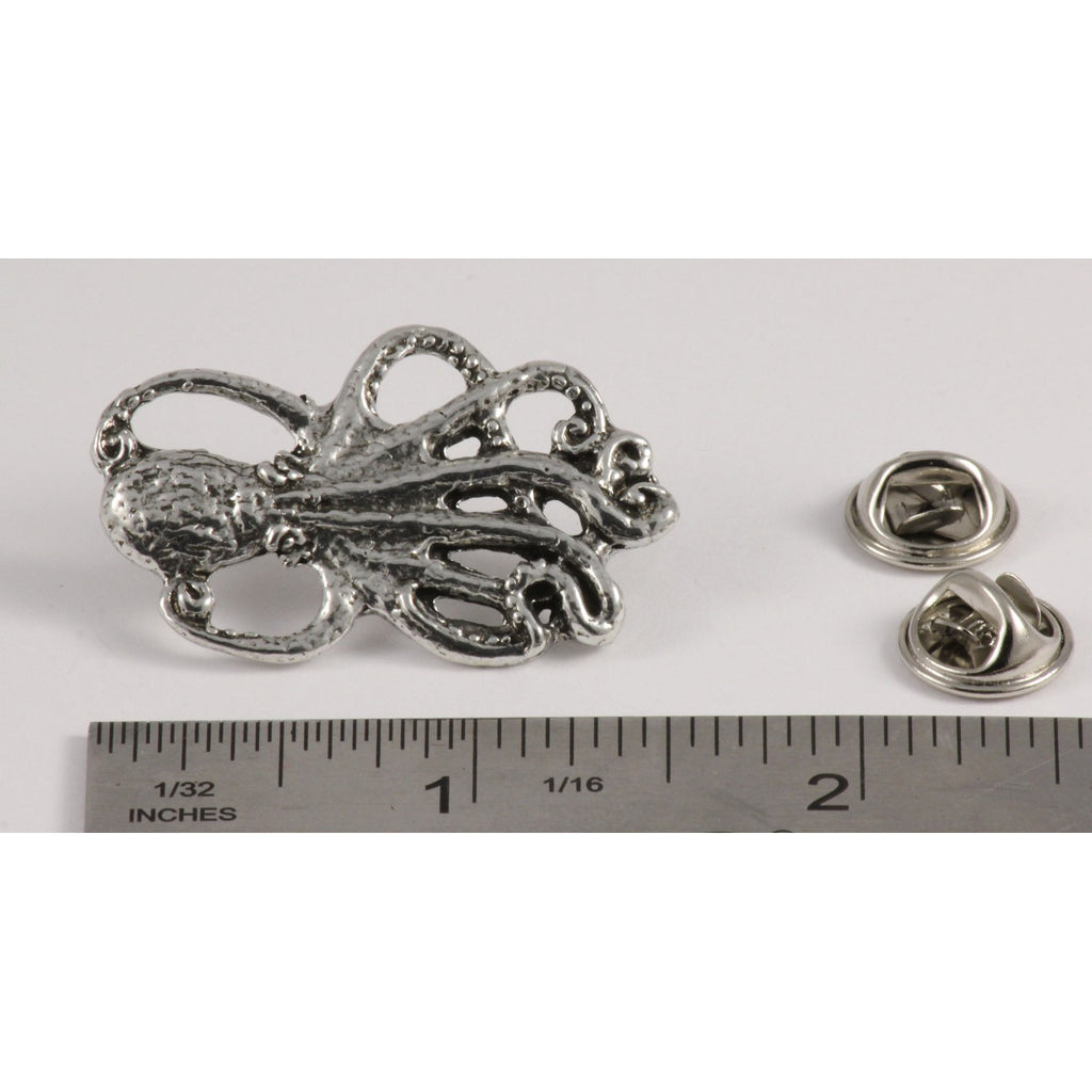 A handcrafted Octopus Pin next to a ruler, available for sale at Creativeartisan.com - the image offers a sense of scale