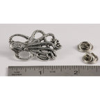A handcrafted Octopus Pin next to a ruler, available for sale at Creativeartisan.com - the image offers a sense of scale