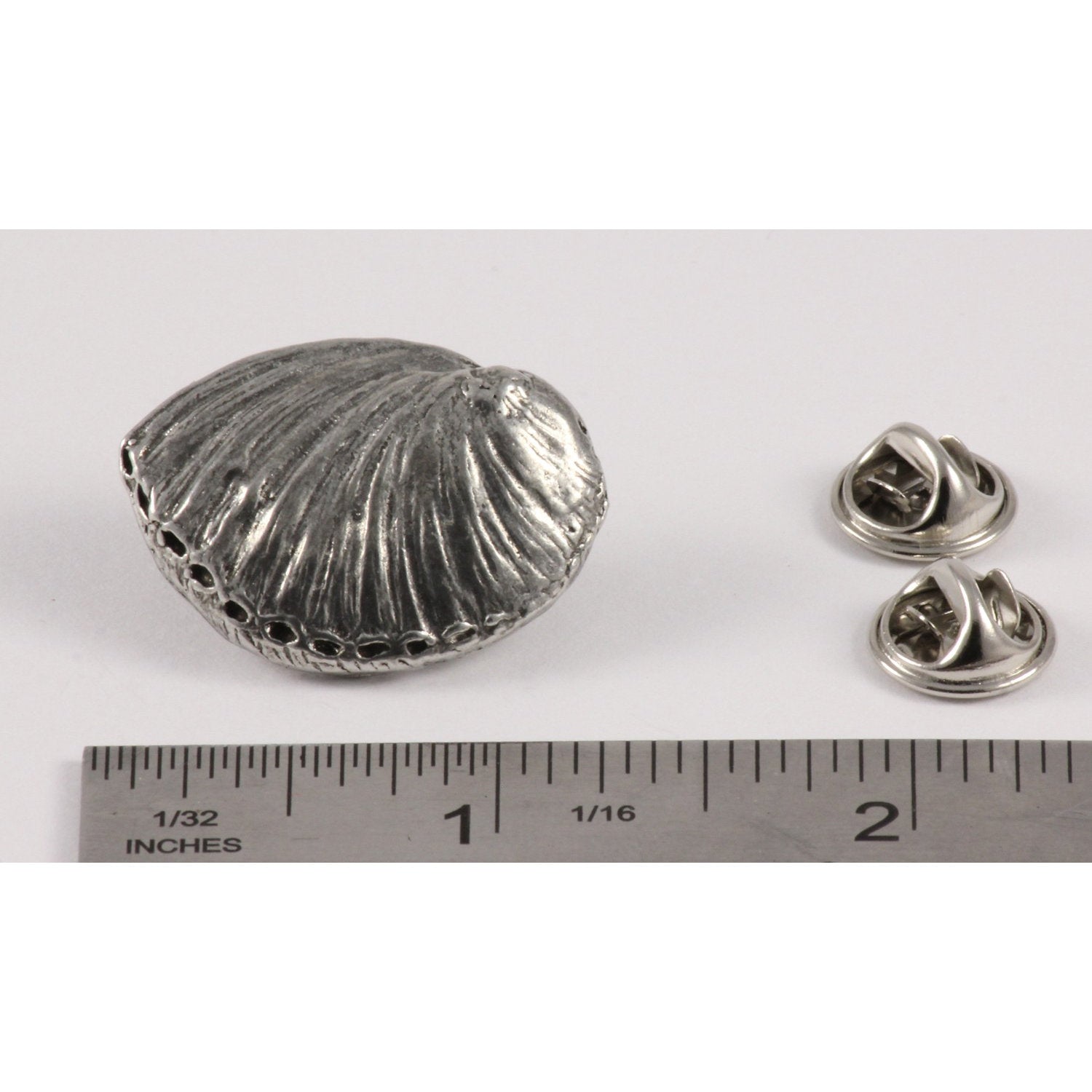 A handcrafted Abalone Shell Pin next to a ruler, available for sale at Creativeartisan.com - the image offers a sense of scale