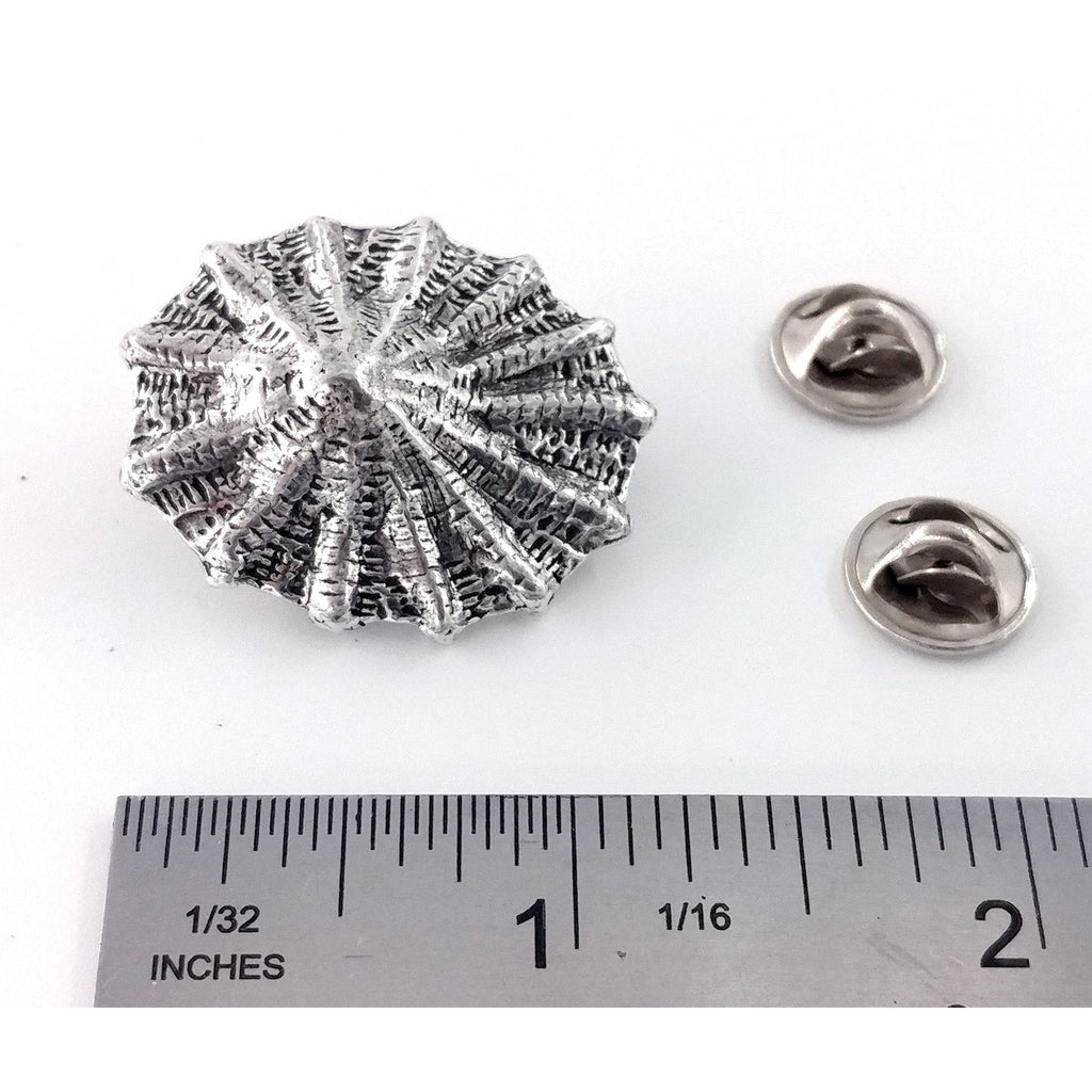 A handcrafted Limpet Pin next to a ruler, available for sale at Creativeartisan.com - the image offers a sense of scale
