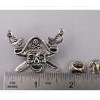A handcrafted Pirate Head Pin next to a ruler, available for sale at Creativeartisan.com - the image offers a sense of scale