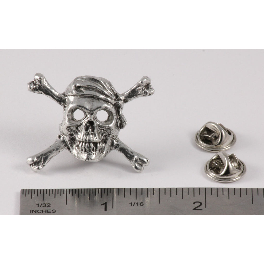 A handcrafted Pirate Skull Crossbones Pin next to a ruler, available for sale at Creativeartisan.com - the image offers a sense of scale