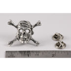 A handcrafted Pirate Skull Crossbones Pin next to a ruler, available for sale at Creativeartisan.com - the image offers a sense of scale