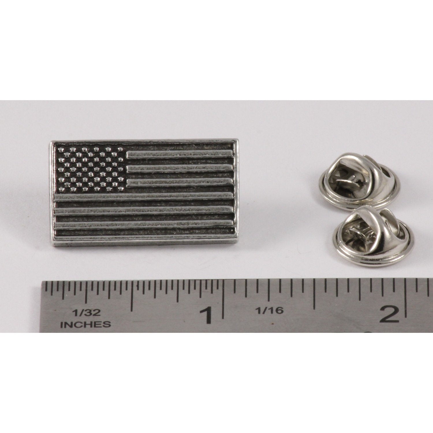 A handcrafted American Flag Profile Pin next to a ruler, available for sale at Creativeartisan.com - the image offers a sense of scale