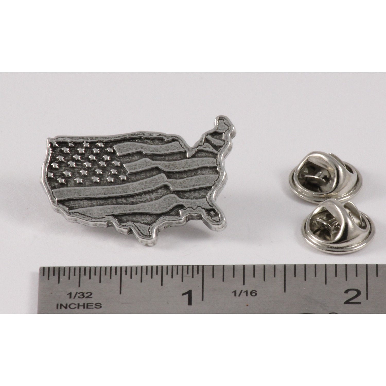 A handcrafted American Flag In Usa Outline Large Pin next to a ruler, available for sale at Creativeartisan.com - the image offers a sense of scale