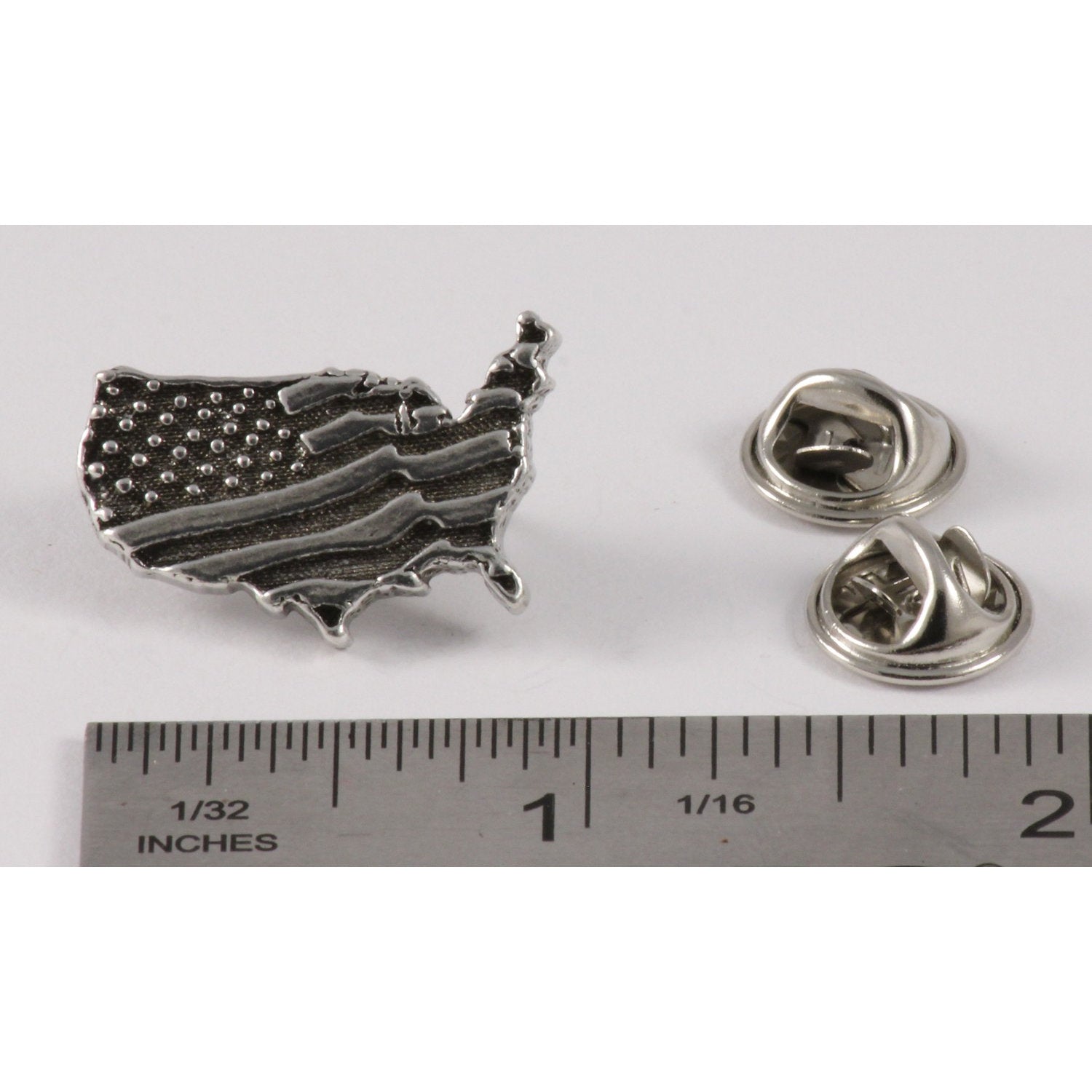 A handcrafted American Flag In Usa Outline Small Pin next to a ruler, available for sale at Creativeartisan.com - the image offers a sense of scale