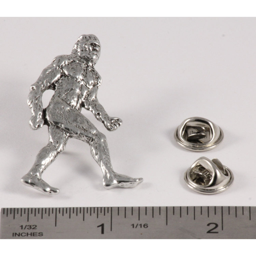 A handcrafted Sasquatch Bigfoot Full Body Pin next to a ruler, available for sale at Creativeartisan.com - the image offers a sense of scale