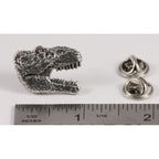 A handcrafted Tyrannosaurus Rex Head Pin next to a ruler, available for sale at Creativeartisan.com - the image offers a sense of scale